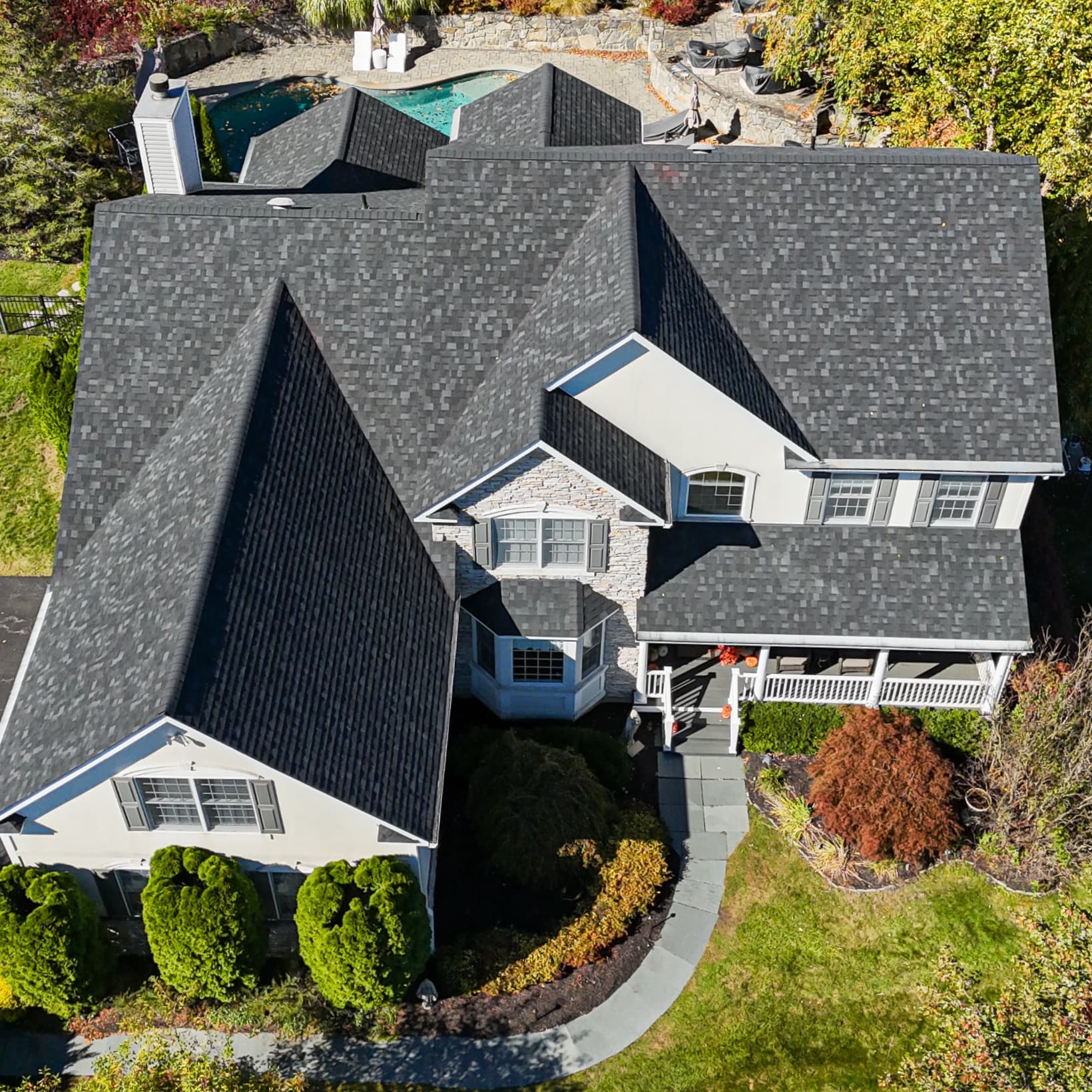 Aerial view of a gray shingle roof on a large home in Hopewell Junction, NY