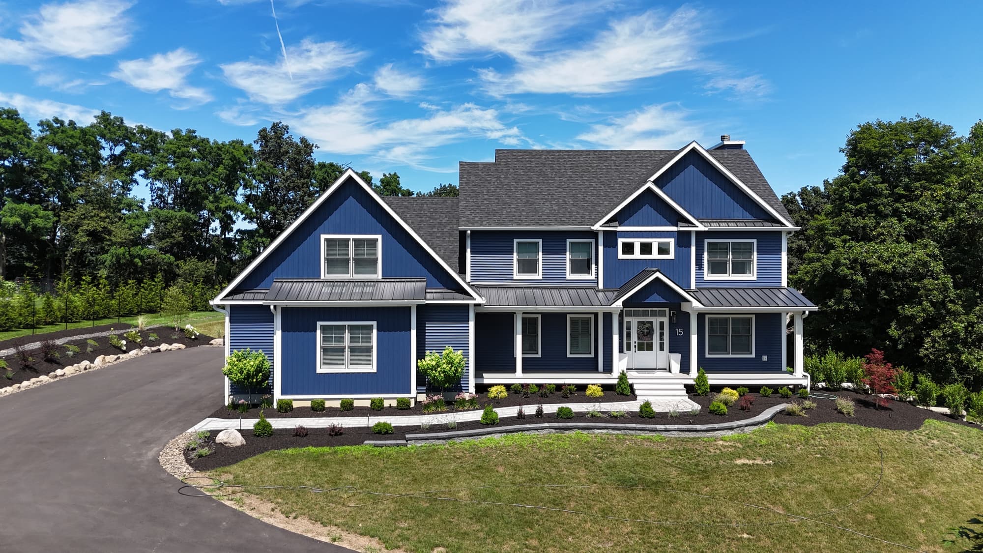Navy blue siding installation on a large two story home in New Windsor, NY